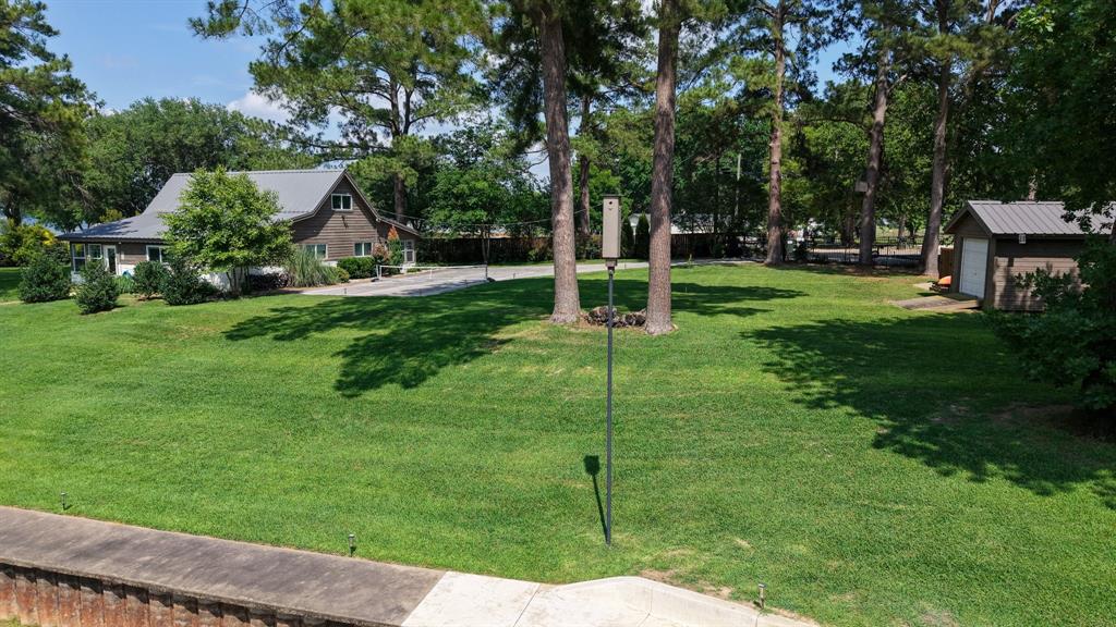 132 Goodknight Ranch Road Trinidad, TX 75163 - Photo 6 of 40 Situated on 2 lots with towering pine trees with room to expand home, add garage, add a pool and more.