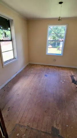 an empty room with windows