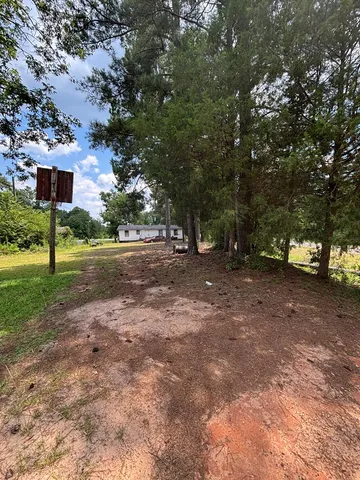 a view of a road with a building in the background