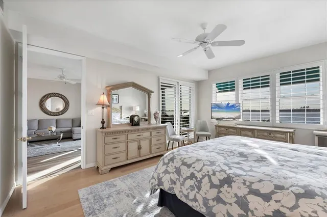 a bedroom with a large bed and a window