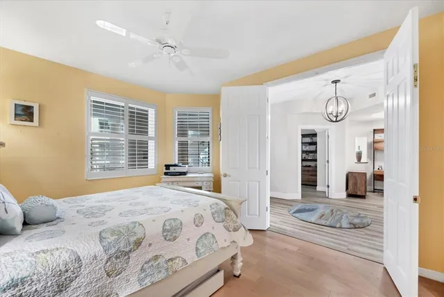 a bedroom with a large bed and a window