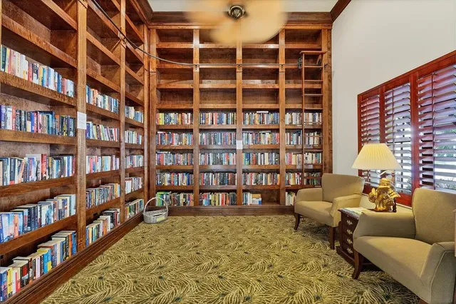 a swimming pool with outdoor seating and yard