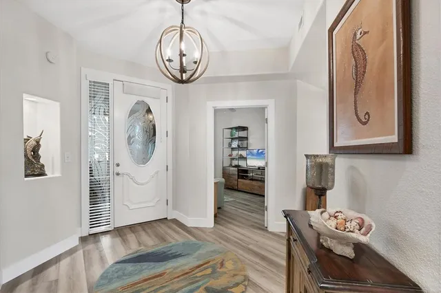 a view of a room with wooden floor and window