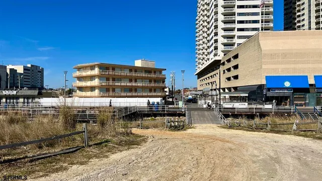a view of a swimming pool with outdoor seating