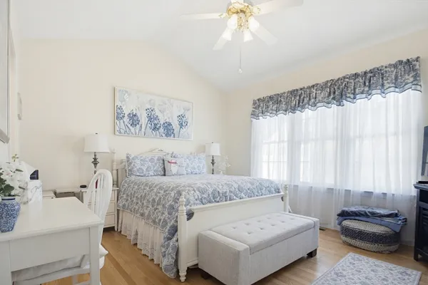 a bedroom with a bed and a couch