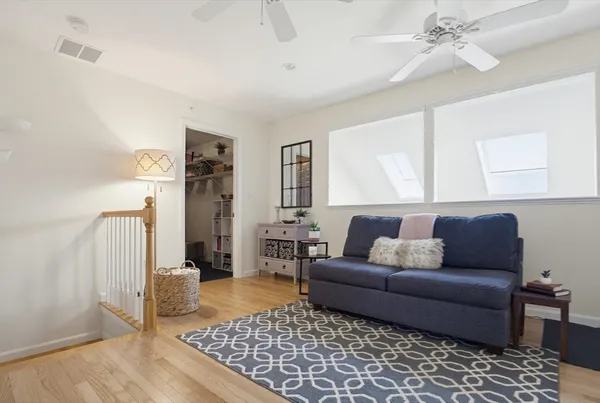a living room with furniture and a rug
