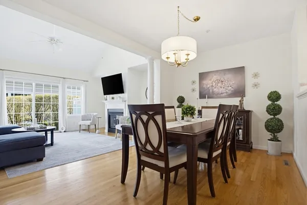 a view of a dining room with furniture window and wooden floor
