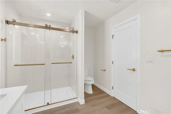 a bathroom with a shower and a toilet