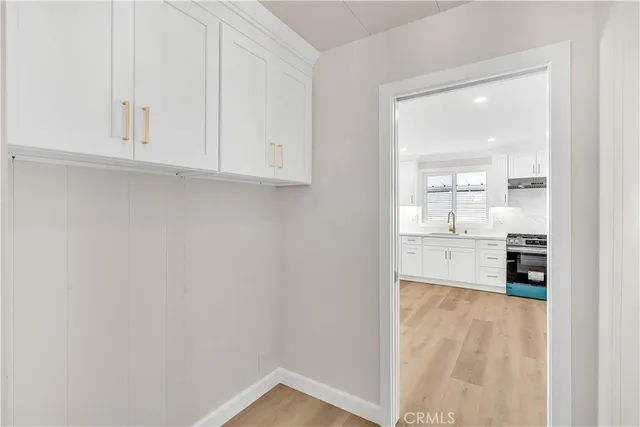 a view of kitchen with wooden floor