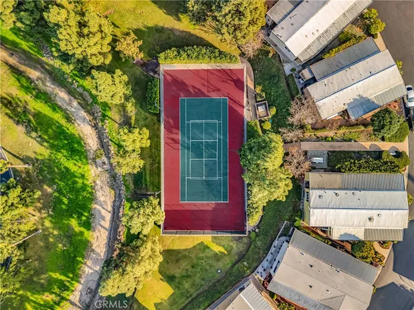 an aerial view of a swimming pool and mountain view