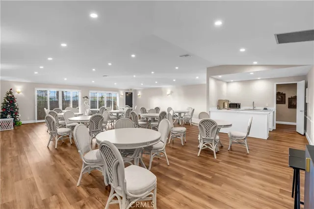 a living room with fireplace furniture and a wooden floor
