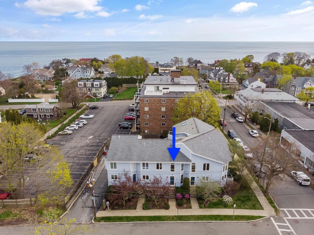 an aerial view of a house with a ocean view