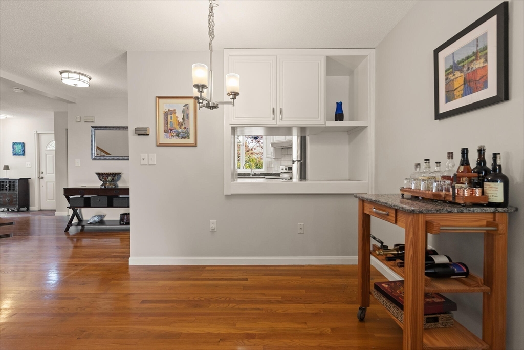 15 Flume Road, Unit 4 Gloucester, MA 01930 - Photo 11 of 41 a view of a dining room with furniture and wooden floor
