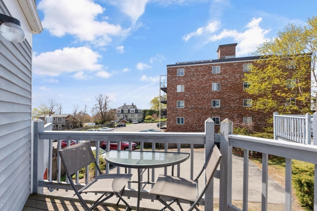 15 Flume Road, Unit 4 Gloucester, MA 01930 - Photo 13 of 41 a view of a chairs and table in the balcony