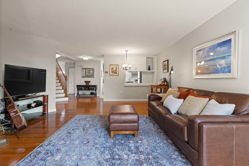 15 Flume Road, Unit 4 Gloucester, MA 01930 - Photo 14 of 41 a living room with furniture and a flat screen tv