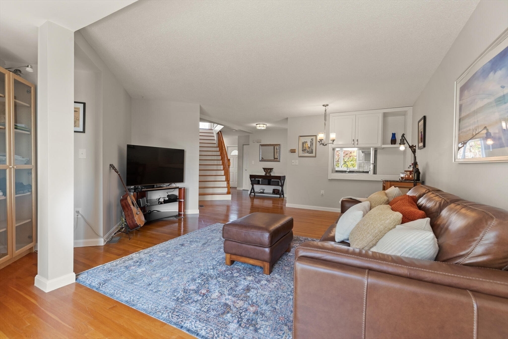 15 Flume Road, Unit 4 Gloucester, MA 01930 - Photo 17 of 41 a living room with furniture and a flat screen tv