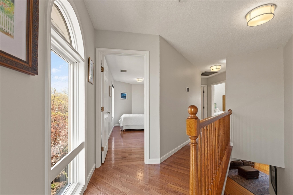 15 Flume Road, Unit 4 Gloucester, MA 01930 - Photo 20 of 41 a view of a hallway and a livingroom with furniture