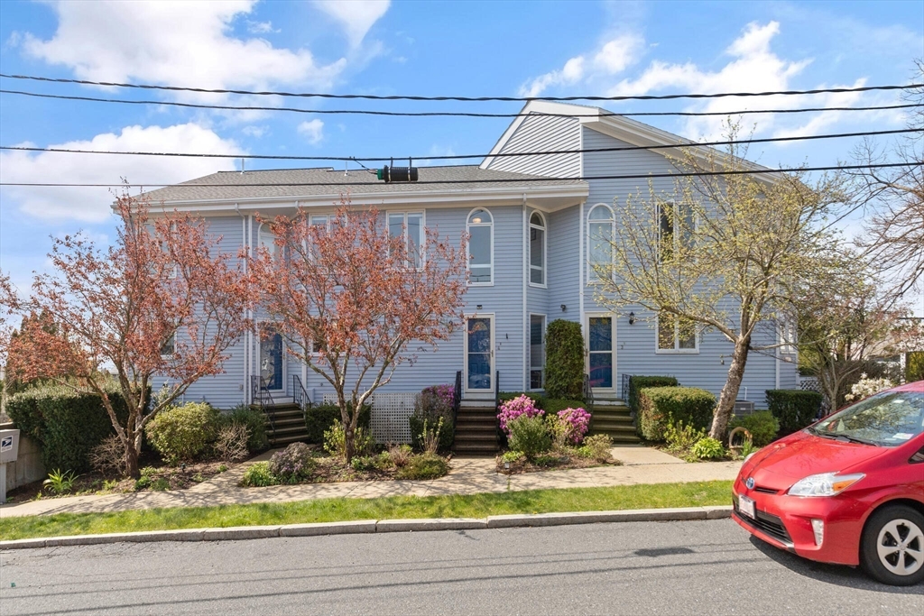15 Flume Road, Unit 4 Gloucester, MA 01930 - Photo 41 of 41 a front view of a house with garden and plants