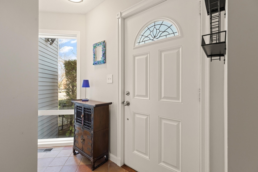 15 Flume Road, Unit 4 Gloucester, MA 01930 - Photo 6 of 41 a view of a hallway with paintings on the wall