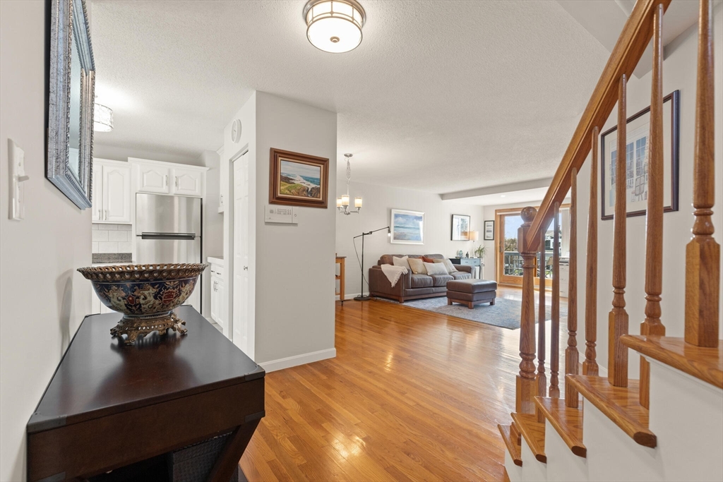 15 Flume Road, Unit 4 Gloucester, MA 01930 - Photo 7 of 41 a living room with furniture and a wooden floor