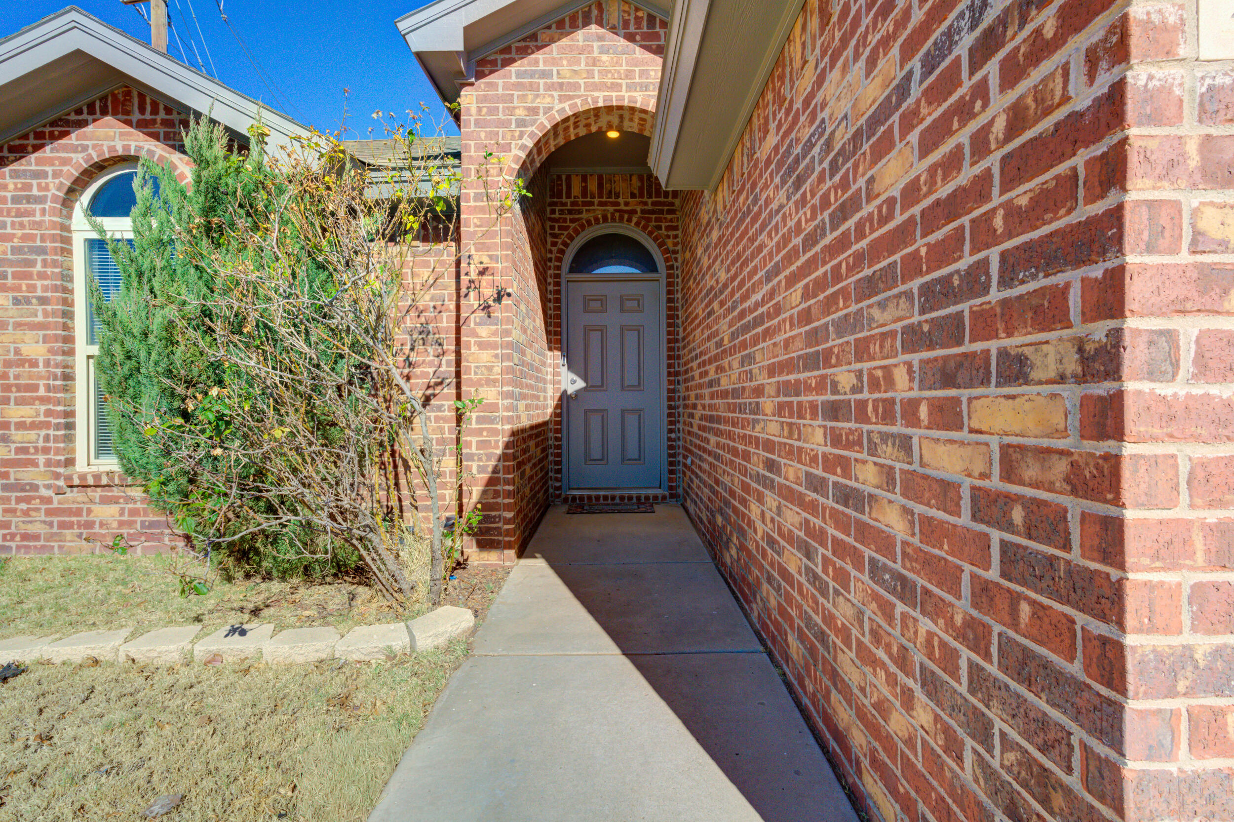 2022 88th Street Lubbock, TX 79423 - Photo 2 of 33 a front view of a house with a garden
