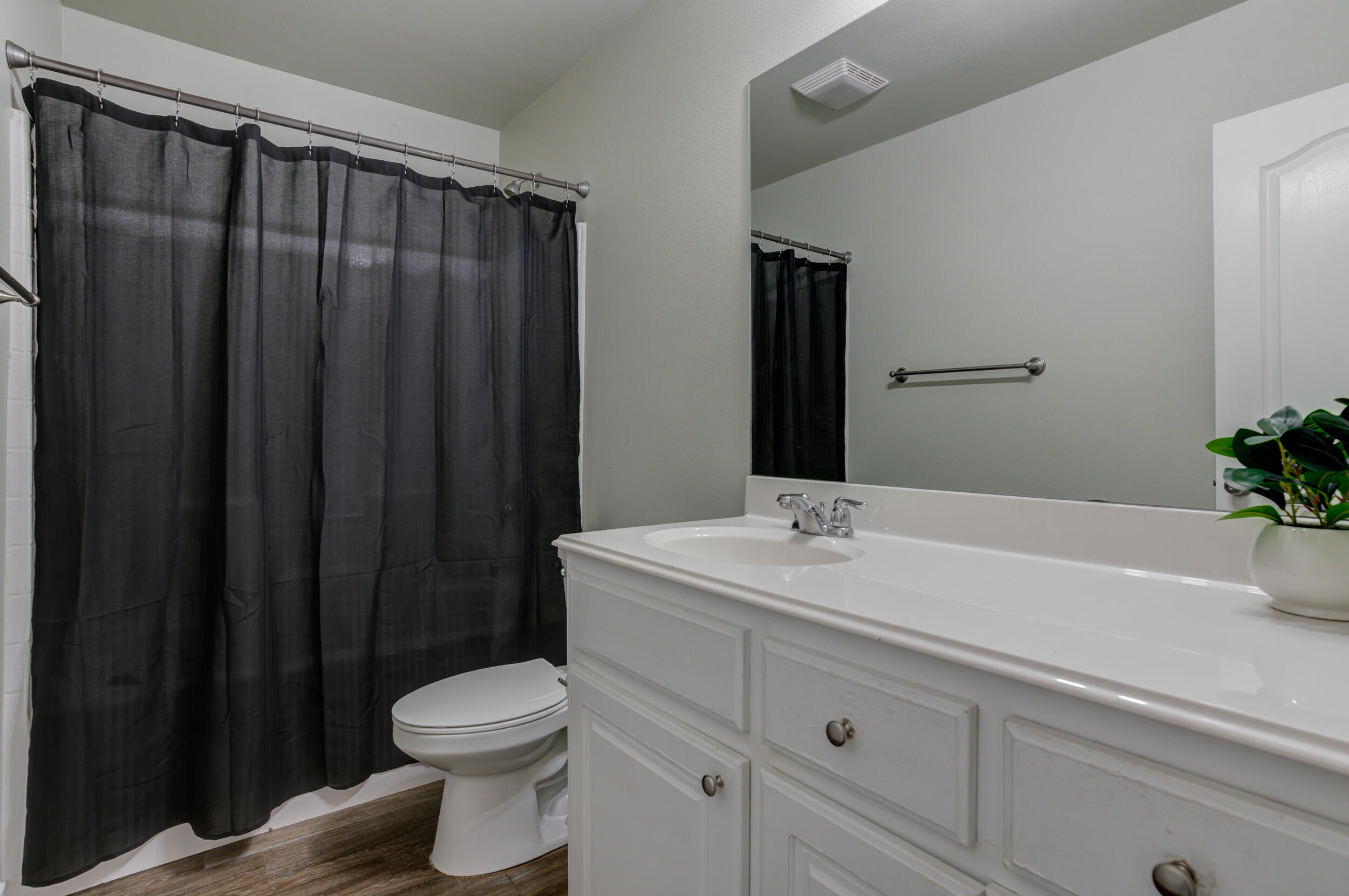 2022 88th Street Lubbock, TX 79423 - Photo 25 of 33 a bathroom with a sink a toilet and shower