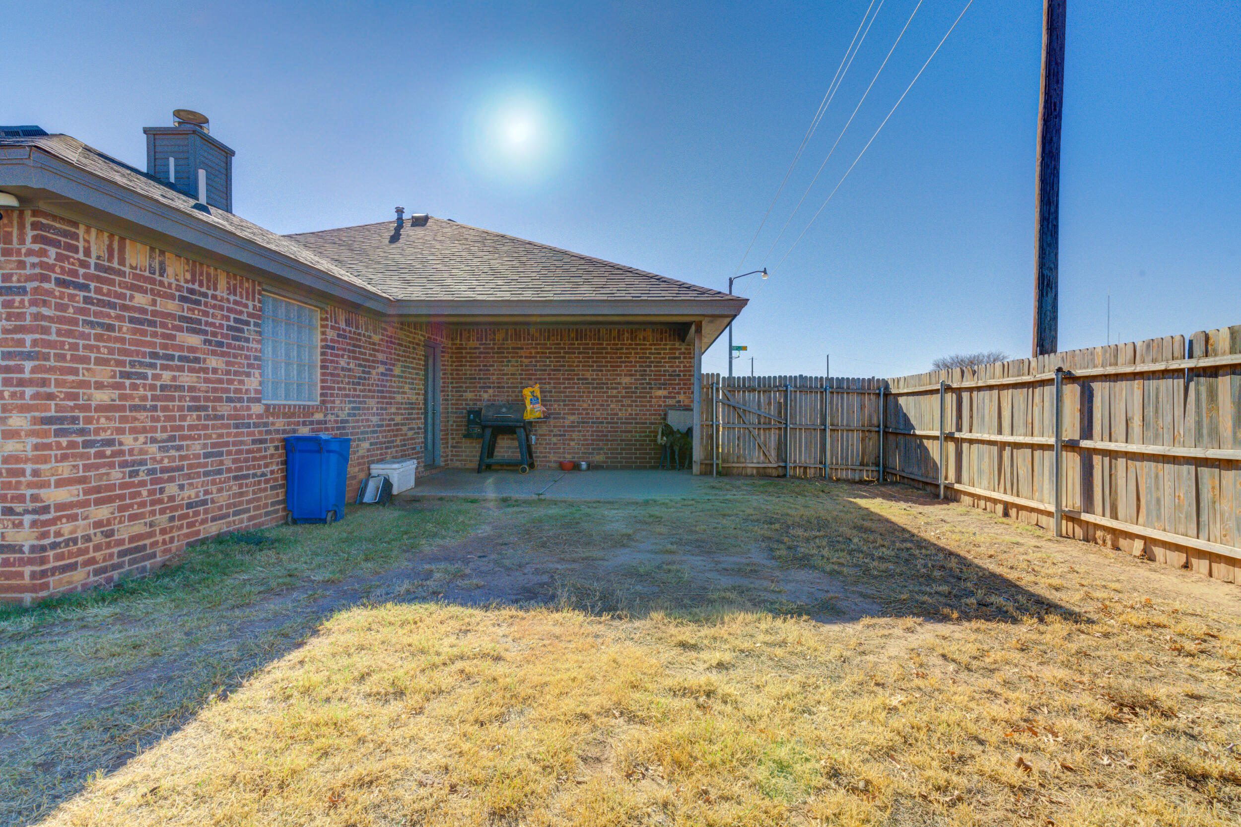 2022 88th Street Lubbock, TX 79423 - Photo 32 of 33 a view of a house with a yard