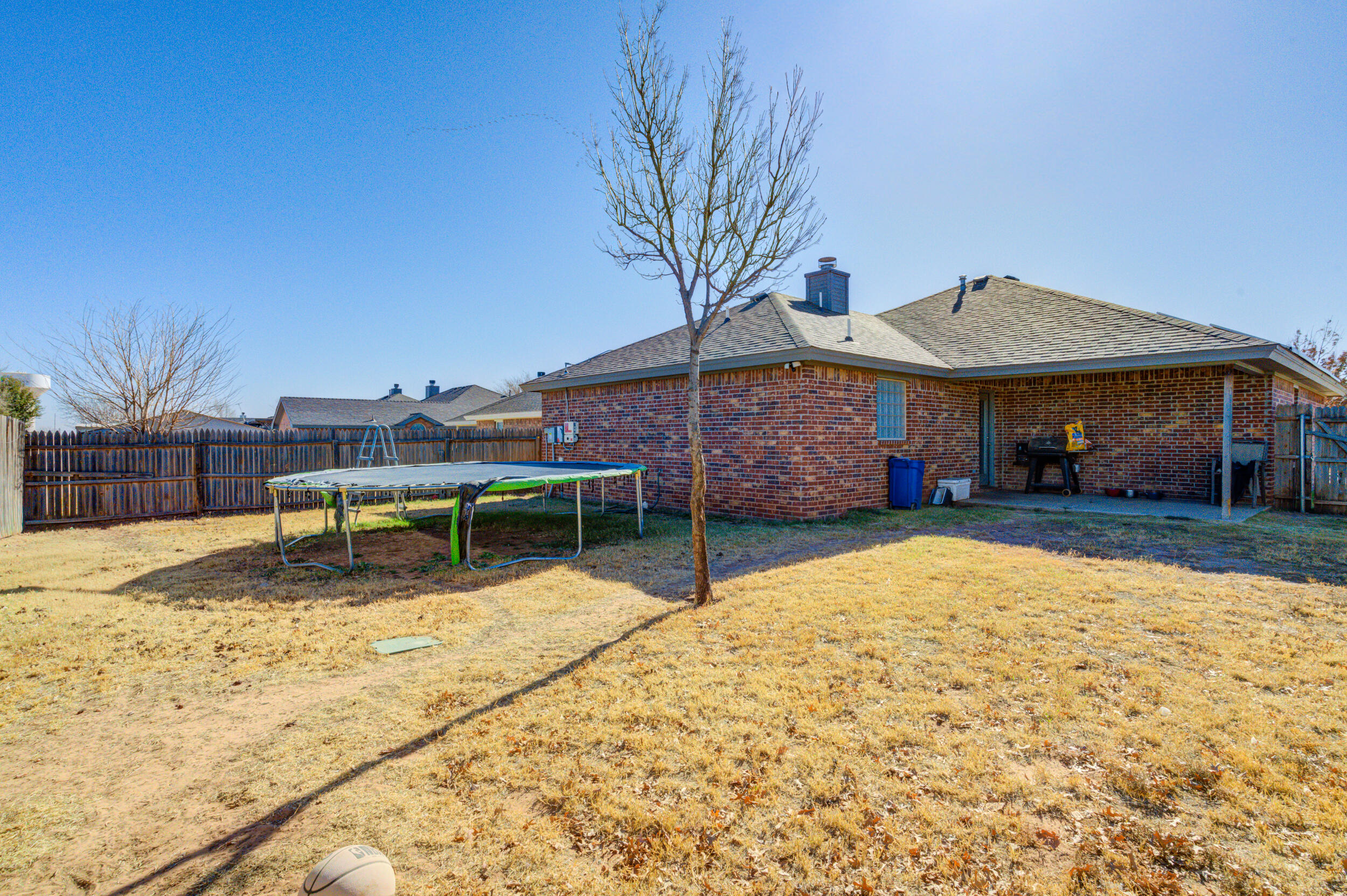 2022 88th Street Lubbock, TX 79423 - Photo 33 of 33 a house with trees in front of it