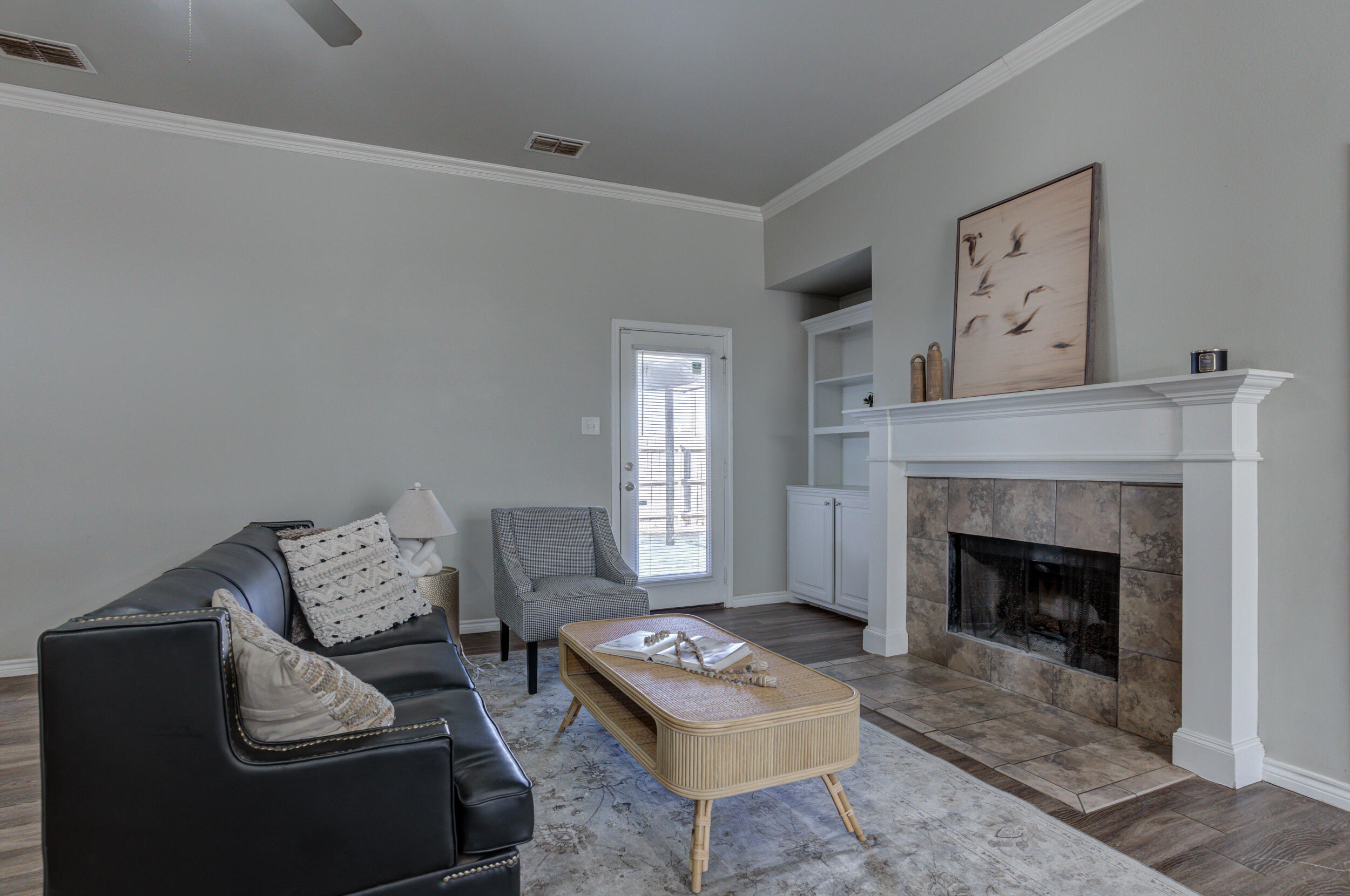 2022 88th Street Lubbock, TX 79423 - Photo 5 of 33 a living room with furniture and a fireplace