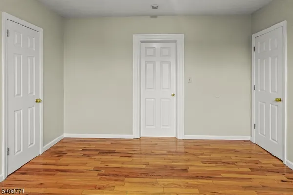 a view of room and wooden floor