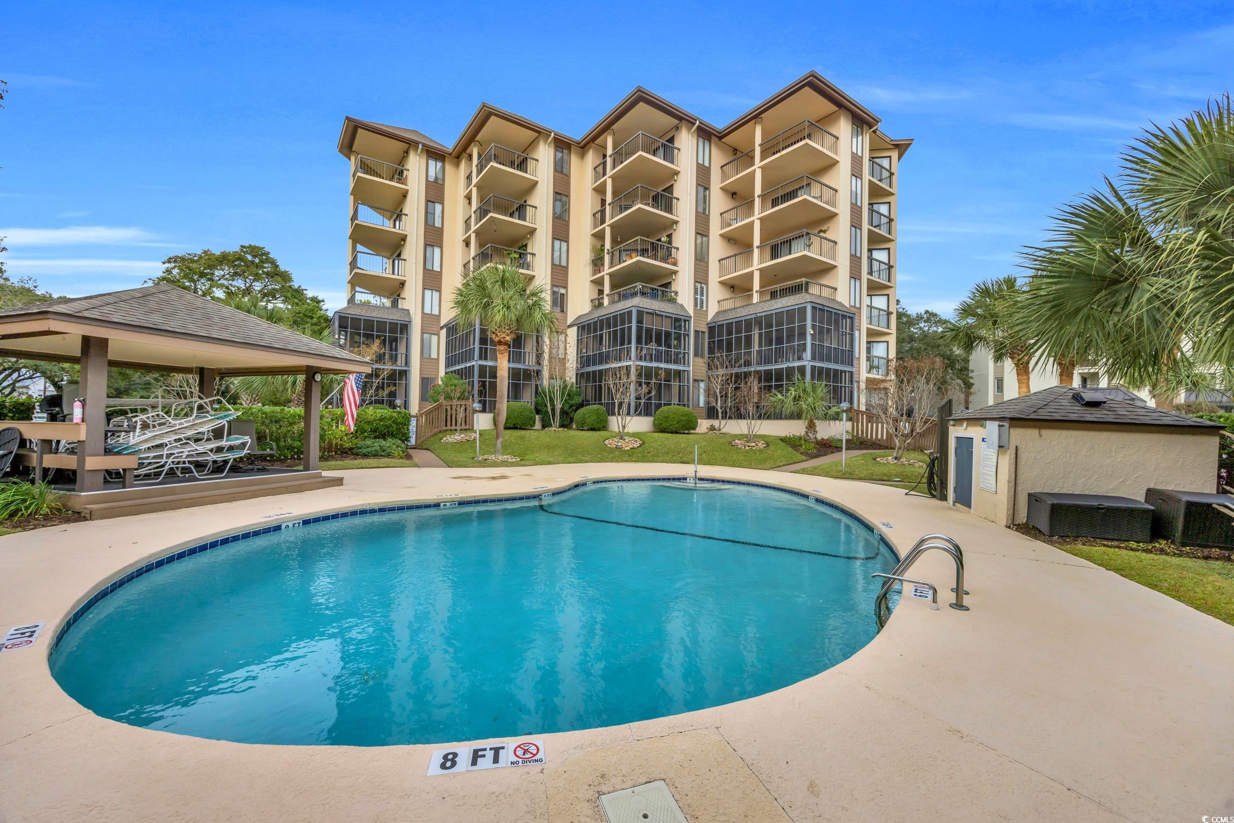 310 73rd Avenue North, Unit 5C Myrtle Beach, SC 29572 - Photo 20 of 20 Community pool with a gazebo and a patio area