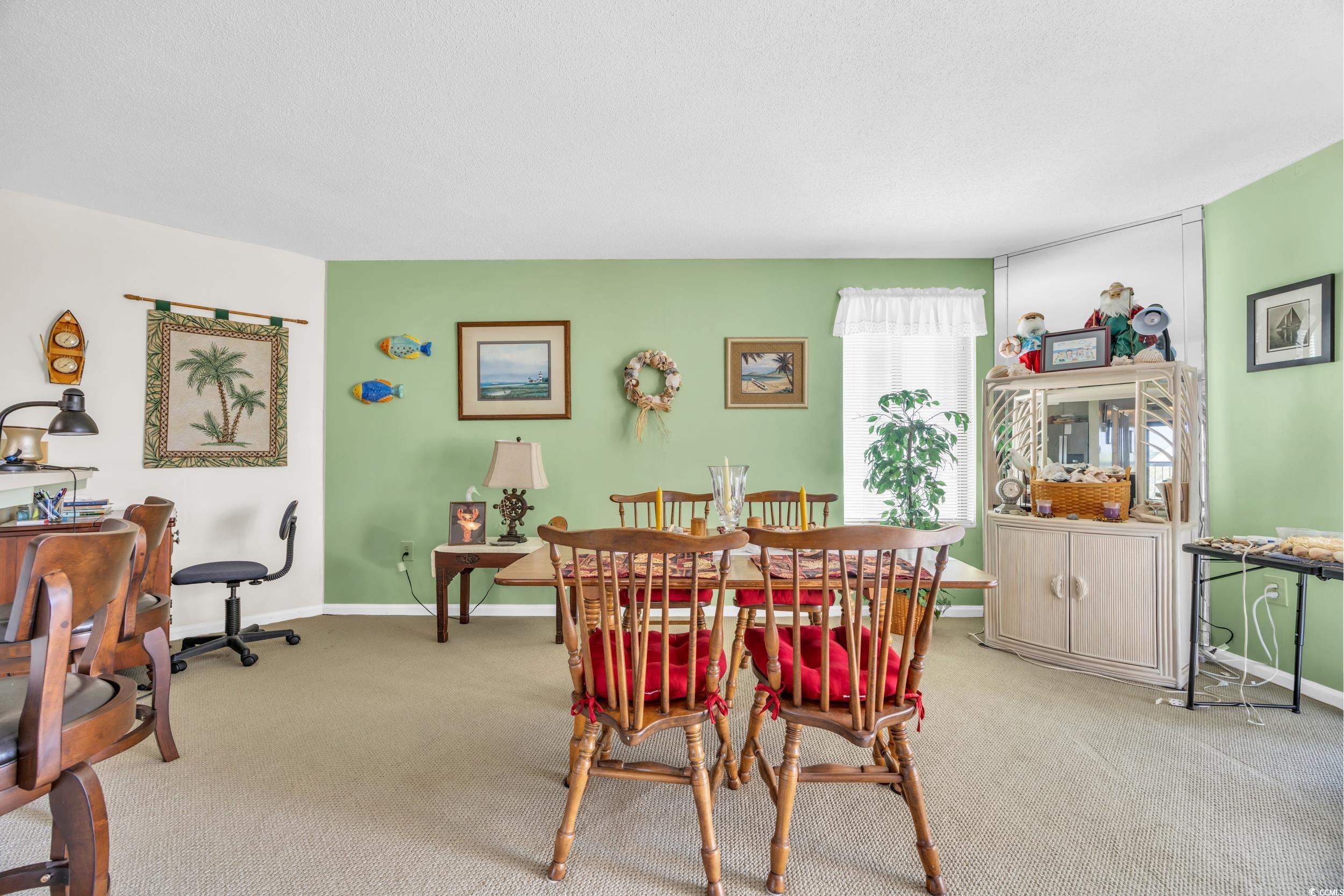 310 73rd Avenue North, Unit 5C Myrtle Beach, SC 29572 - Photo 7 of 20 Dining space featuring carpet flooring