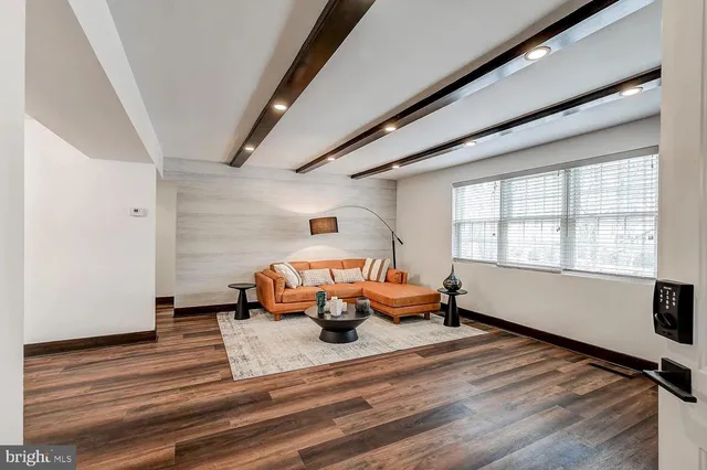 a bedroom with furniture window and wooden floor