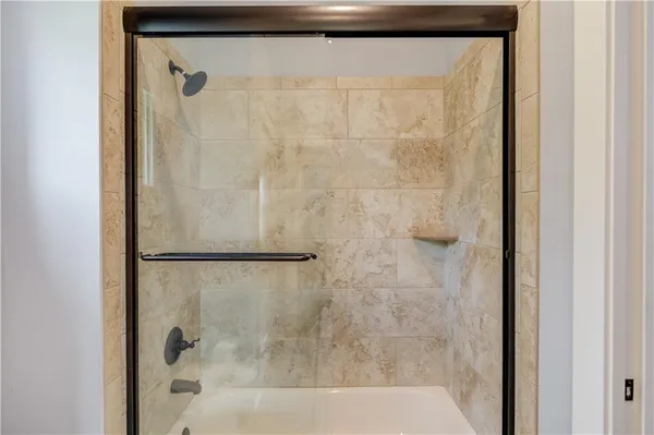 a kitchen with a sink a stove and cabinets