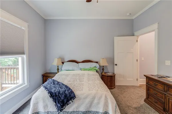 a room with pool table and windows