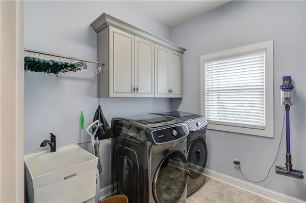 a spacious bedroom with a bed and a window