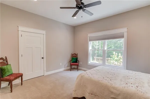 a view of a field with trees in the background