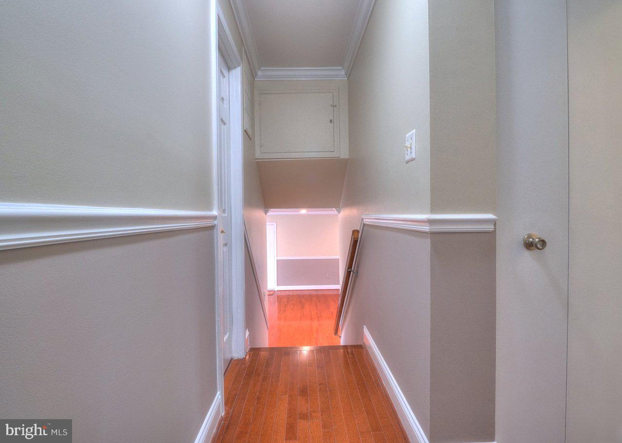 2405 Earlsgate Court Reston, VA 20191 - Photo 56 of 56 Inviting hallway with warm wood floors.
