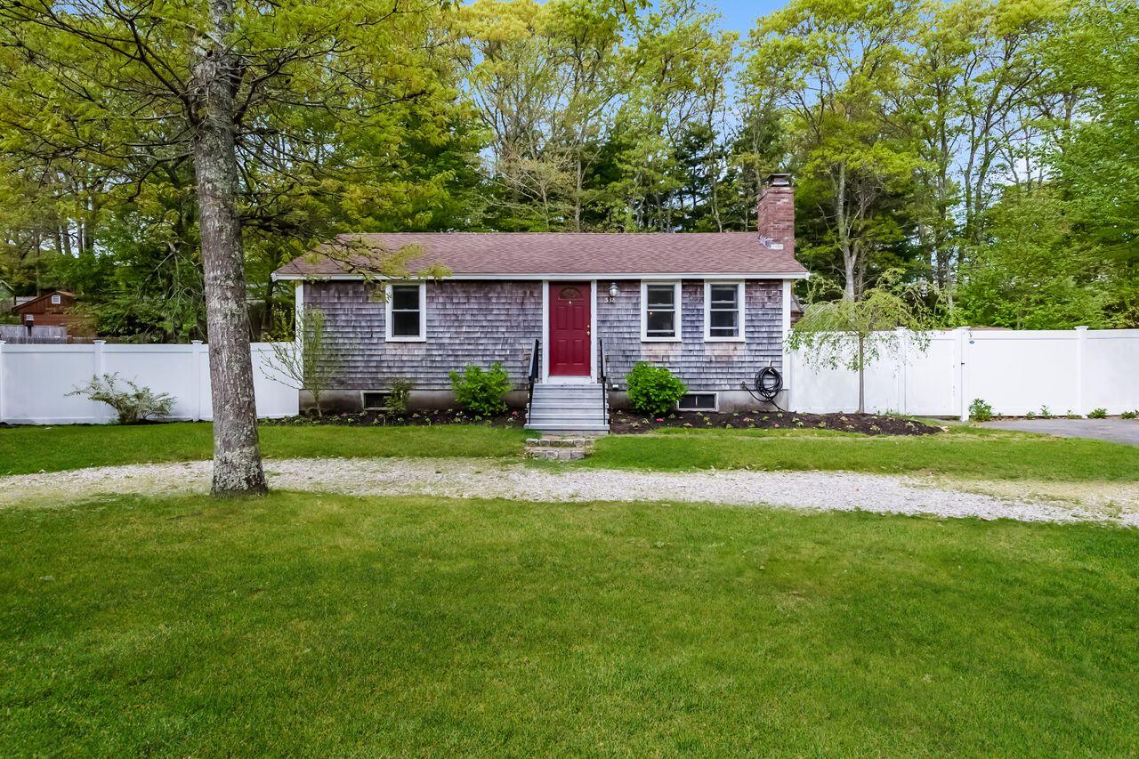 538 Cotuit Road Mashpee, MA 02649 - Photo 1 of 29 a view of a house with a big yard plants and large trees