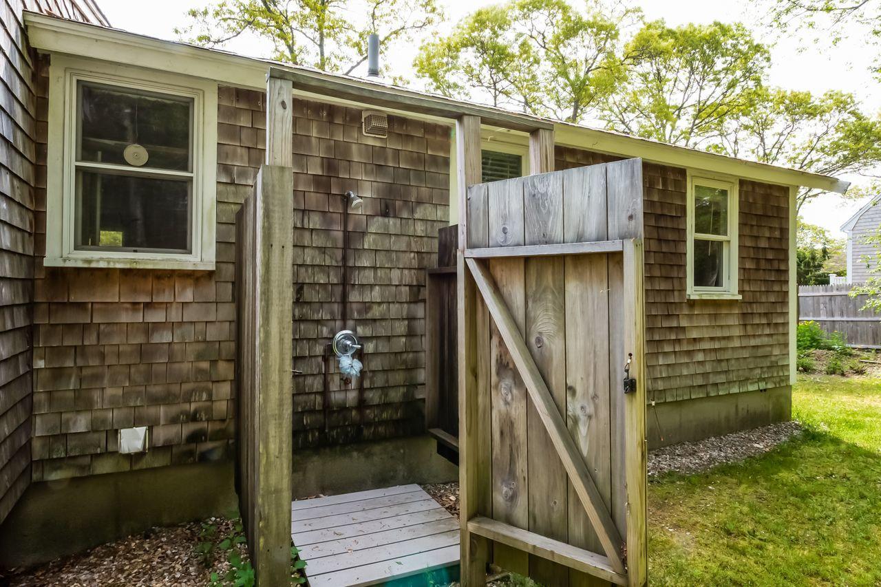 538 Cotuit Road Mashpee, MA 02649 - Photo 23 of 29 a view of a house with backyard and wooden door