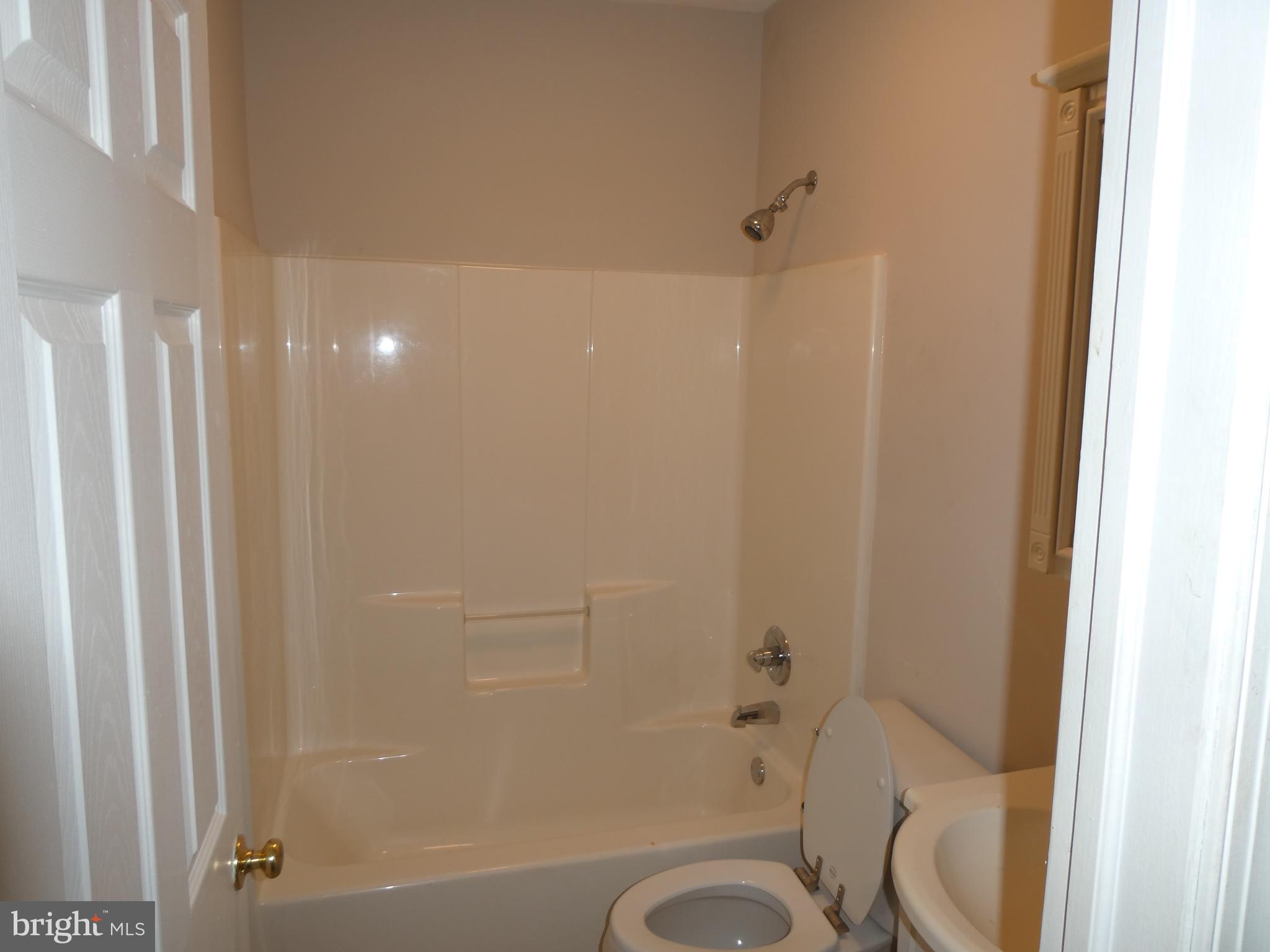 2024 Elm Avenue Atco, NJ 08004 - Photo 14 of 25 a bathroom with a shower and toilet