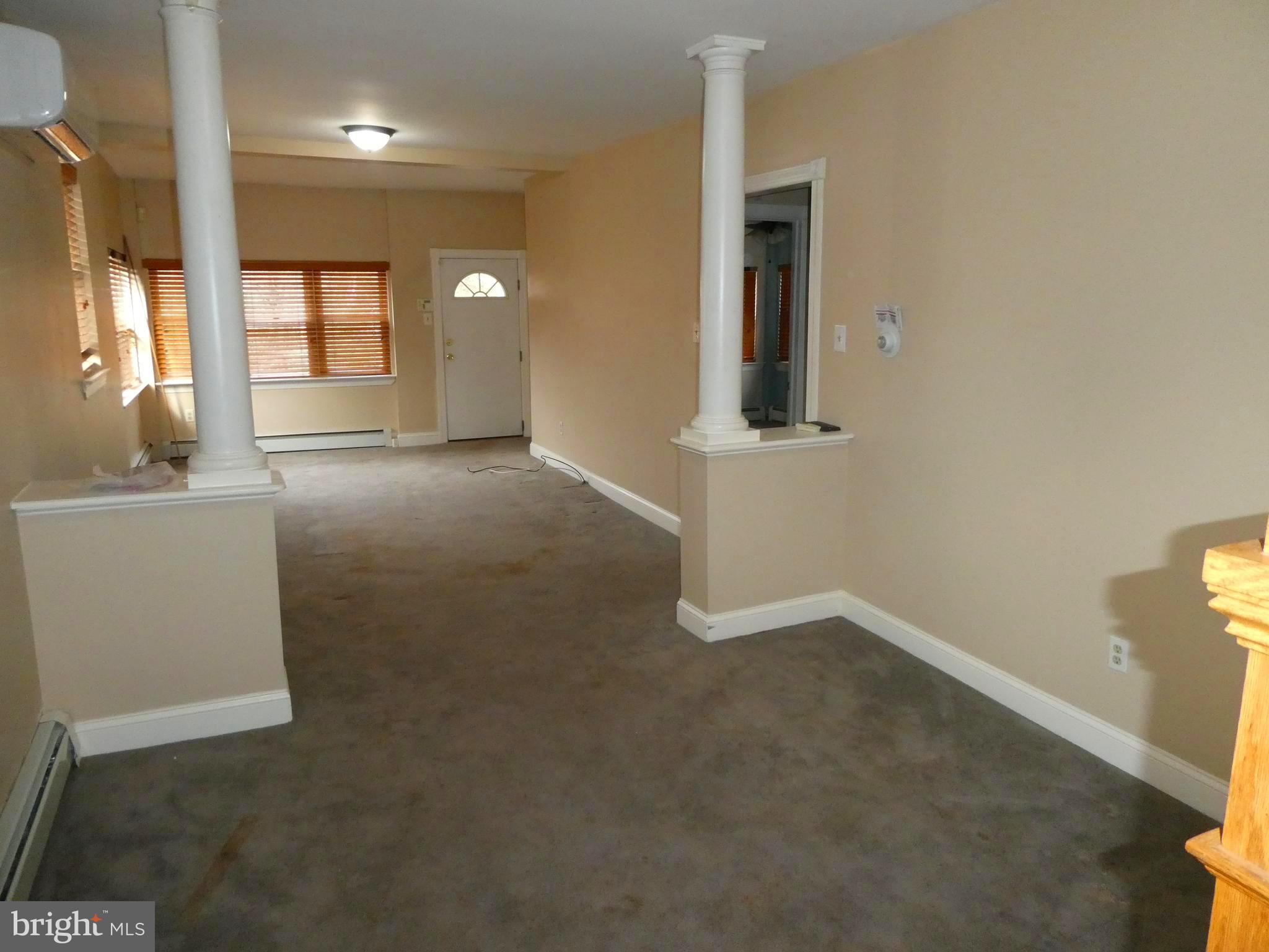 2024 Elm Avenue Atco, NJ 08004 - Photo 3 of 25 an empty room with windows and cabinet