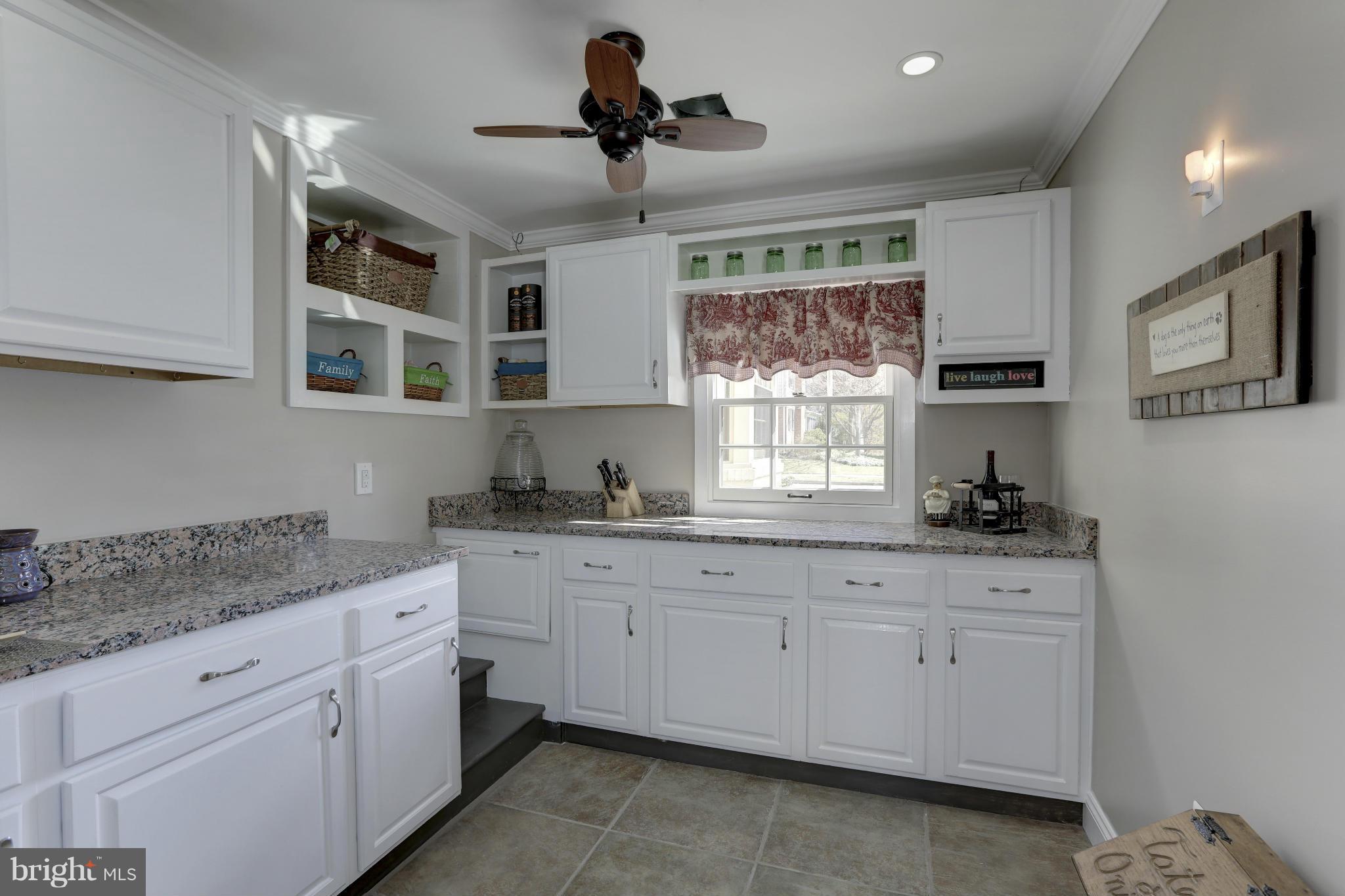 808 Chumleigh Road Baltimore, MD 21212 - Photo 14 of 30 Granite counters. Pantry with pass thru to Kitchen