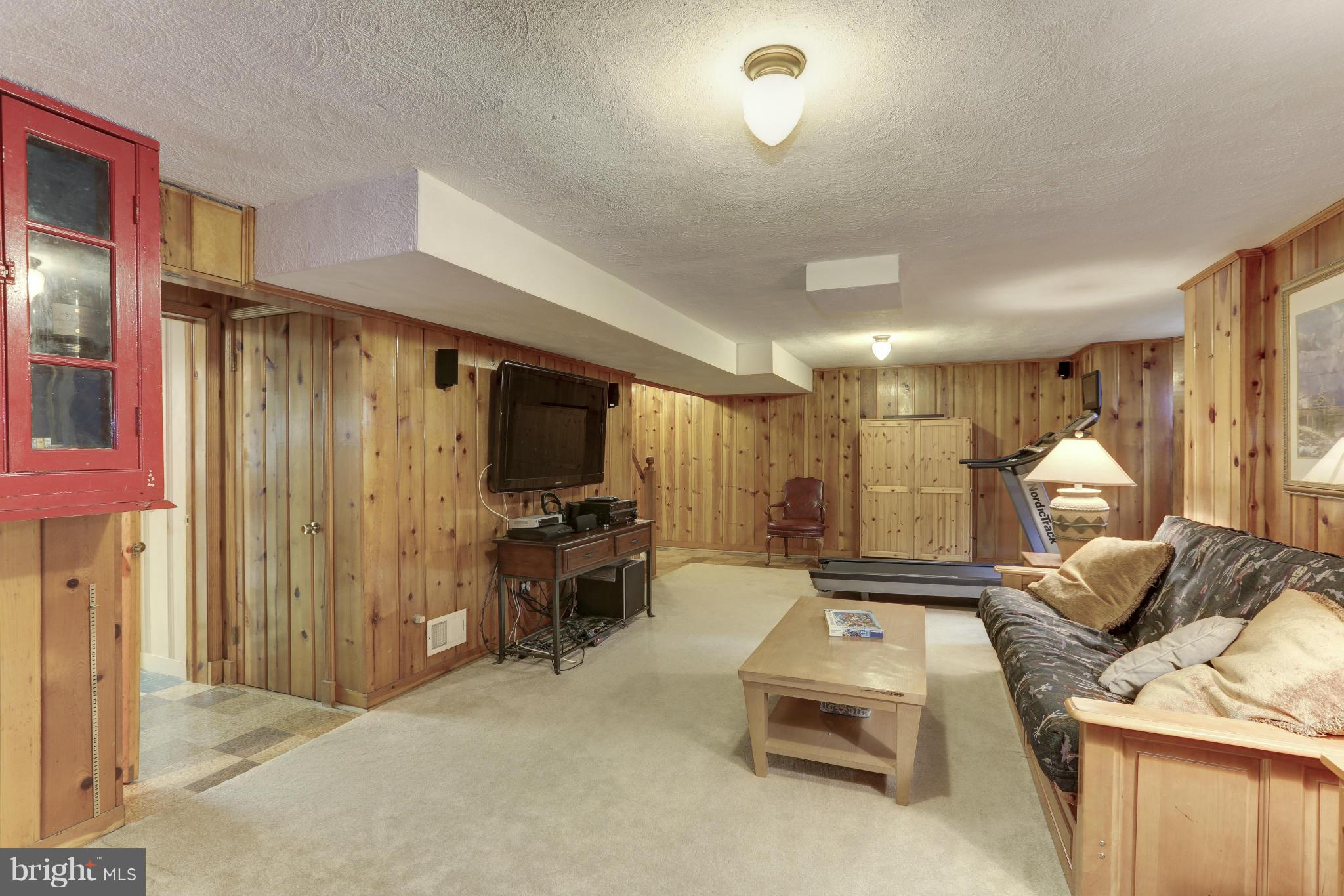 808 Chumleigh Road Baltimore, MD 21212 - Photo 25 of 30 Lower level family room with original knotty pine