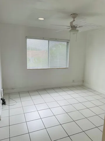 a bathroom with a sink a toilet a mirror and shower