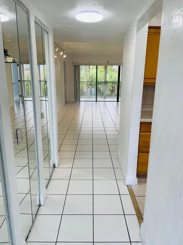 a view of entryway with a floor to ceiling window