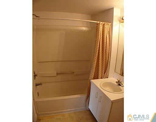 914 Edpas Road New Brunswick, NJ 08901 - Photo 9 of 11 a bathroom with a shower and a sink