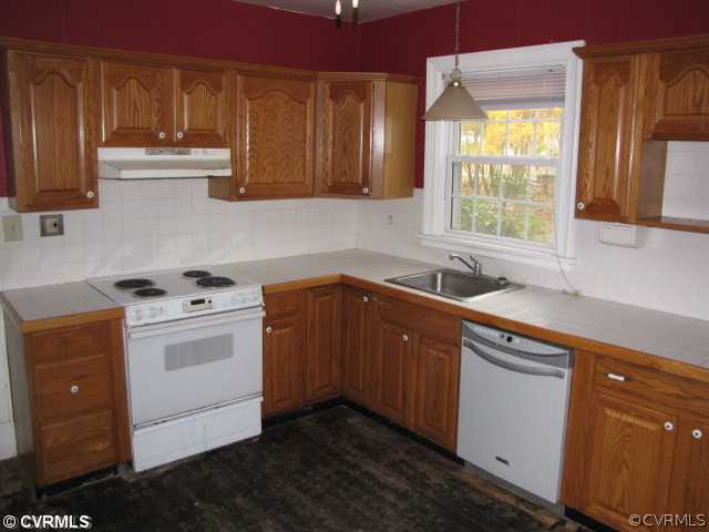 29521 Carson Road Carson, VA 23830 - Photo 3 of 12 a kitchen with a sink cabinets and window