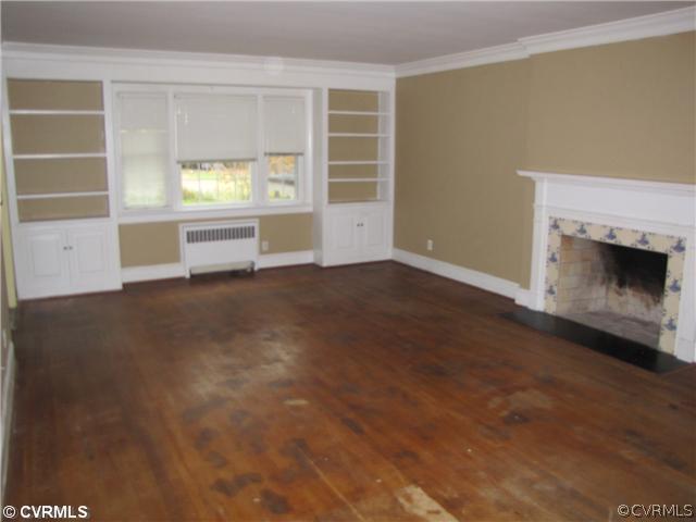 29521 Carson Road Carson, VA 23830 - Photo 4 of 12 an empty room with windows and fireplace