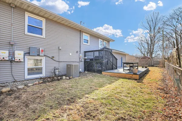 a view of a yard with a large tree